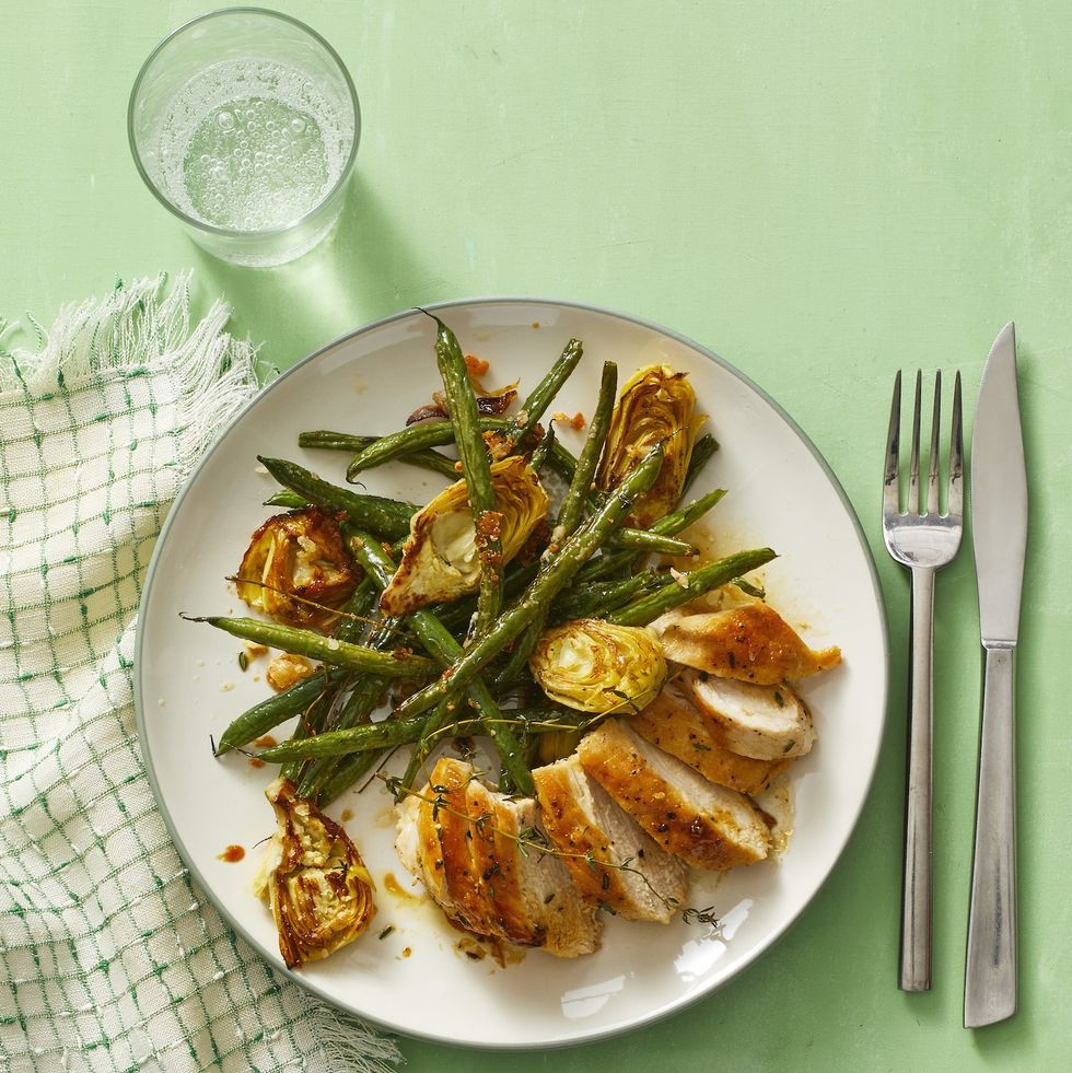 Lemon-Thyme Chicken by Mike Garten
This gluten-free weeknight dinner is full of good-for-you ingredients. Trust us, you'll want to double the amount of Parmesan-thyme roasted veggies.